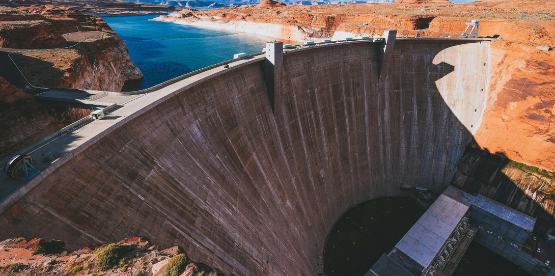 "Stretching across the Colorado River in Arizona, the Glen Canyon Dam is a vital resource, managing water for over 40 million people and powering the southwestern United States with hydroelectric energy.